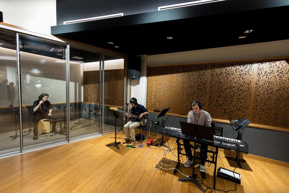 学生 practicing and using the new recording studio in the BMC